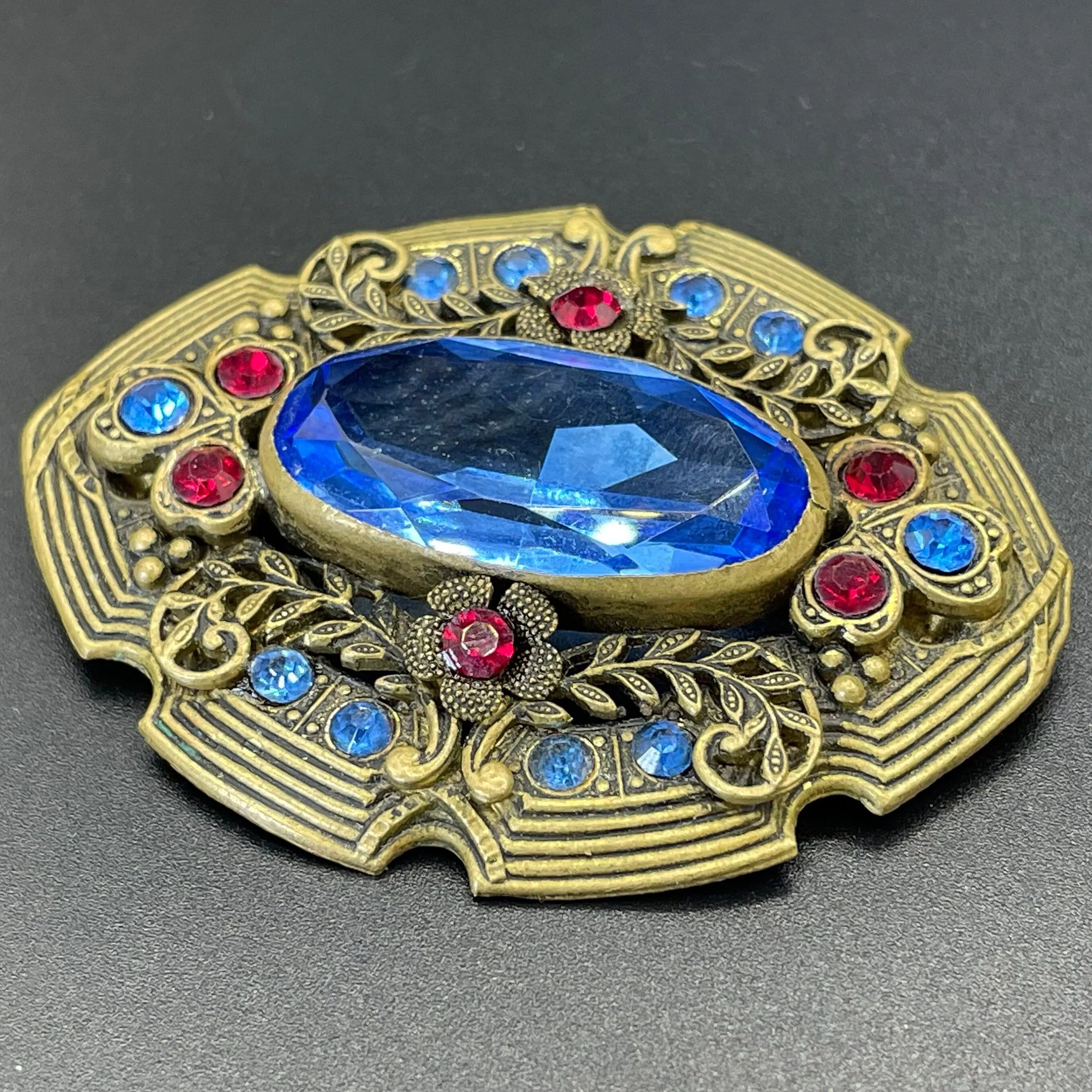 Large vintage Art Deco sapphire blue and bright ruby red rhinestone and ornate gold tone floral design Czech brooch, Neiger style