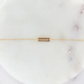 "LOVED" TINY PLATE BRACELET IN BRUSHED GOLD